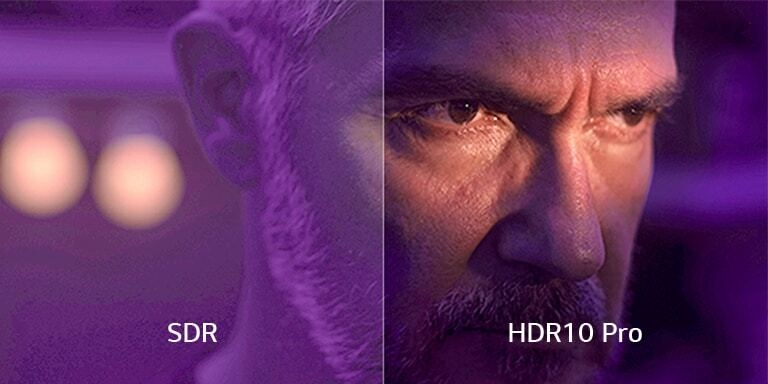 Une image divisée en gros Écran partagé montrant en gros plan le visage d'un homme dans une pièce sombre aux teintes violettes. À gauche, « SDR » est affichée sur une image floutée. À droite, « HDR10 Pro » est affiché sur une image claire et d’une définition nette.du visage d’un homme est présenté dans une pièce sombre teintée de violet. Sur la gauche, « SDR » est affiché et l’image est floue. Sur la droite, « HDR10 Pro » est affiché et l’image est nette et défini avec précision.